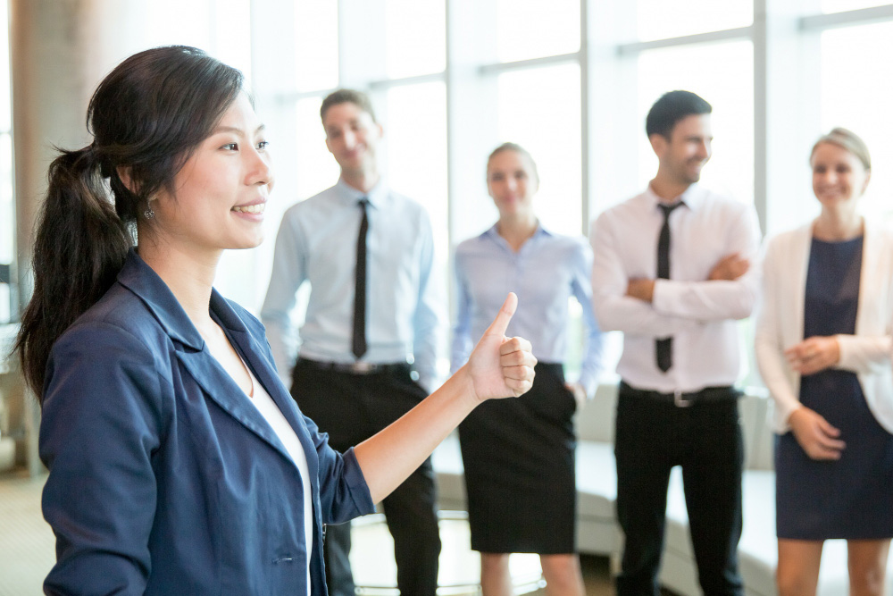 successful-asian-lady-showing-thumb-up